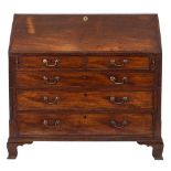 A late George III mahogany bureau:,