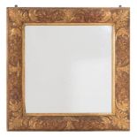 A carved giltwood and gesso mirror:, of square outline,