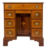 An early 19th Century mahogany and later inlaid kneehole desk:,