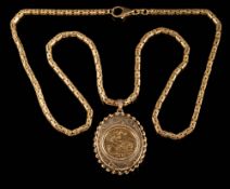 A half sovereign dated '1982', mounted within a 9ct gold locket and on a 9ct gold,