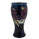 A Moorcroft pottery vase: of waisted form, tube lined in the Pansies pattern in white, blue, red,
