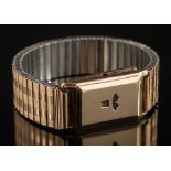 A gentleman's 9ct gold cased duo-dial rectangular wristwatch: with concealed hour and second dials,