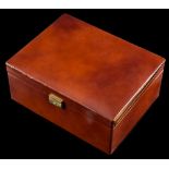 A tan leather covered jewellery box: with various compartments, approximately 30cm long x 23cm,
