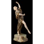 Rossi (20th Century Italian) A bronze and ivory dancer: arching backwards with right leg raised,