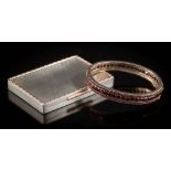 A Bohemian garnet mounted hinged bangle and a silver cigarette case with chased gold border and