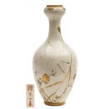 A Japanese Satsuma bottle vase: decorated with a crane flying above reeds and flowers on a ground