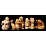 A Japanese carved ivory netsuke: depicting an old man scratching his back whilst reading a book,