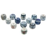 A collection of thirteen Chinese porcelain scroll weights: of barrel form,