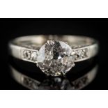 A diamond solitaire ring: the round old brilliant-cut diamond approximately 7.7mm diameter x 3.