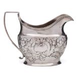 A George III silver cream jug, maker's mark worn, London, 1803: of barge shaped outline,