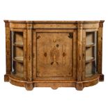 A Victorian walnut credenza:, the central door with sycamore inlaid decoration after the classical,