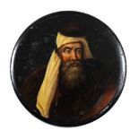 A 19th century papier mache snuff box: the circular lid decorated with a portrait of a bearded