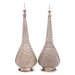 A pair of Indo-Persian silver flasks and stoppers:, of ovoid form with long slender necks,