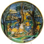 An Italian maiolica istoriato footed dish: painted with Picus on horseback persuing a boar and the