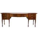 A George III mahogany and inlaid sideboard:, of bowed and concave fronted outline,