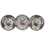 A pair of Chinese verte Imari plates and one other: the pair painted with lotus,