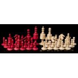 A 19th century Indian ivory Barleycorn-style pattern chess set: one side stained red,