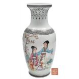 A Chinese porcelain vase: of baluster form decorated with two elegant ladies in a garden setting