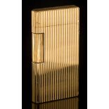 Caran d'Ache. A gold plated lighter: of ribbed design.