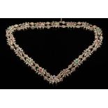 A late 19th or early 20th century continental gem-set necklace: with sixteen cushion-shaped links