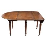 An early 19th century mahogany oval drop flap extending dining table:,