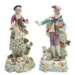 A pair of Derby figures of 'The Dresden Shepherds': the shepherdess wearing a puce coat,