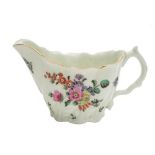 A First Period Worcester 'Chelsea ewer' cream jug: spirally moulded with acanthus leaves from the