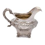 A Victorian silver cream jug, maker Robert Death, London, 1845: crested,