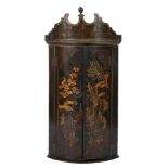 A late 18th Century green lacquer and gilt chinoiserie bow-fronted hanging corner cupboard:,