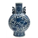 A Chinese blue and white moon flask: with pierced foliate handles,