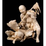 A Japanese carved ivory okimono of a peasant: the figure holding a plough and surprised by a snake
