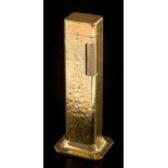 A Dunhill 'Tallboy' table lighter: of hammered finish, approximately 11cm overall height.