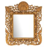 A 19th Century Indian carved gilt wood easel mirror:, with scallop shell cresting,
