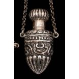 A late 19th century Continental silver scent bottle: of tapering ovoid form with screw top