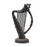 A late 19th century Irish carved bog oak harp: of Celtic design,