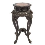 A Chinese carved and ebonised octagonal jardiniere stand:,