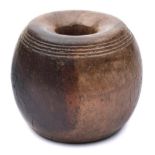 A lignum vitae horse tethering weight: of spherical form with two incised bands of concentric