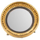 A Regency giltwood and gesso circular convex mirror:,