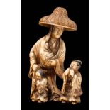 A Japanese carved ivory okimono: of Lady Tokiwa Gozen with her three small children fleeing in the