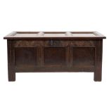 An early 18th Century oak rectangular coffer:, of moulded plain panel construction,