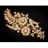 A late 19th century diamond and split seed-pearl floral spray brooch: with two principal flower