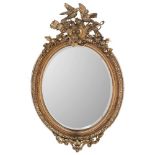 A Victorian giltwood, gesso and grained oval mirror:,