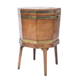 A George III mahogany and brass bound octagonal wine cooler:,