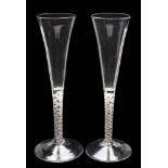 A group of four English wine glasses: comprising a pair with bell-shaped bowls with basal tiers