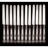 A set of twelve mid-19th century silver dessert knives, maker Pierre Queille, Paris: crested,