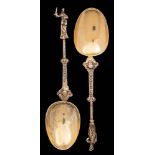 A pair of Continental silver-gilt serving spoons: with pear-shaped bowls,