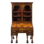 An early 18th Century Italian walnut and marquetry bureau bookcase:,