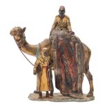 After Franz Bergman a twentieth century cold painted spelter table lighter: of a camel and carpet