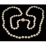 A graduated cultured pearl single-string necklace: with individually knotted,