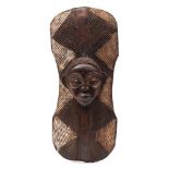 A West African tribal parrying shield: possibly from the Dan tribe (Ivory Coast),
